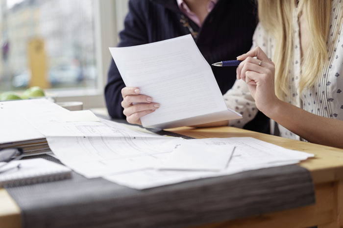 a couple review their will at a kitchener law firm office